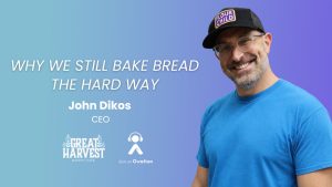 John Dikos, Hospitality Leader at Great Harvest Bakery Cafe, smiling while wearing a blue T-shirt. Episode title: Why We Still Bake Bread the Hard Way. Give an Ovation podcast.